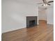 Open-concept living room featuring hardwood floors, a fireplace, and neutral wall colors at 2049 Rector Dr, Atlanta, GA 30311