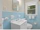 Bathroom featuring blue tiles and updated sink at 2483 Hunting Valley Dr, Decatur, GA 30033