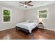 Bedroom features hardwood floors, neutral paint and abundant natural light from dual windows at 2483 Hunting Valley Dr, Decatur, GA 30033