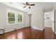 Spacious bedroom featuring hardwood floors, closet and two windows at 2483 Hunting Valley Dr, Decatur, GA 30033
