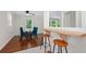 Open dining area boasts hardwood floors, modern lighting and a built in bar at 2483 Hunting Valley Dr, Decatur, GA 30033
