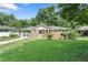 Charming brick home featuring a well-maintained lawn and mature trees in a desirable neighborhood at 2483 Hunting Valley Dr, Decatur, GA 30033