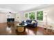 Spacious living room with hardwood floors, large windows, and a ceiling fan at 2483 Hunting Valley Dr, Decatur, GA 30033