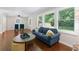 Cozy living room with hardwood floors, natural light, and open access to the dining room at 2483 Hunting Valley Dr, Decatur, GA 30033
