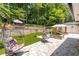 Beautiful backyard featuring lush foliage, comfortable seating, and shaded swings at 2658 Briarlake Ne Rd, Atlanta, GA 30345