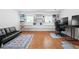 Finished basement with a comfortable black leather sofa, a workspace with dual monitors, and white shelving at 2658 Briarlake Ne Rd, Atlanta, GA 30345