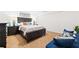 Comfortable bedroom featuring a large wood bed frame, side tables, and decor at 2658 Briarlake Ne Rd, Atlanta, GA 30345
