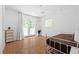 Bright bedroom featuring a unique light fixture, a metal bed frame, and french doors to outside at 2658 Briarlake Ne Rd, Atlanta, GA 30345