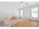 Bright bedroom with hardwood floors, large windows, comfortable reading nook, and adorable tent-bed at 2658 Briarlake Ne Rd, Atlanta, GA 30345