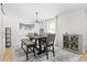Light-filled dining room boasts an elegant light fixture and views of the lush backyard at 2658 Briarlake Ne Rd, Atlanta, GA 30345