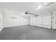 Spacious garage featuring epoxy flooring, a mini-split system, and an automatic door at 2658 Briarlake Ne Rd, Atlanta, GA 30345