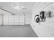 Clean, well-lit garage featuring an electric car charger and epoxy flooring at 2658 Briarlake Ne Rd, Atlanta, GA 30345