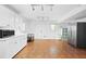 White kitchen features stainless steel appliances, ample cabinetry, and modern lighting at 2658 Briarlake Ne Rd, Atlanta, GA 30345