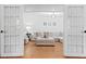 Inviting living room featuring french doors, natural lighting, and neutral-toned furniture at 2658 Briarlake Ne Rd, Atlanta, GA 30345