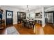 Open concept dining room featuring hardwood floors, modern lighting, and stainless steel kitchen appliances at 3048 Briarcliff Ne Rd # 9, Atlanta, GA 30329