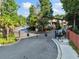 Gated entrance featuring mature trees and nicely maintained landscaping at 3048 Briarcliff Ne Rd # 9, Atlanta, GA 30329
