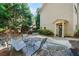 Inviting two-story exterior with lush greenery and a charming front patio with seating at 3048 Briarcliff Ne Rd # 9, Atlanta, GA 30329