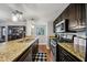 Modern kitchen with granite countertops, stainless steel appliances, and dark wood cabinets at 3048 Briarcliff Ne Rd # 9, Atlanta, GA 30329