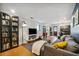 Spacious living room with a comfortable gray sofa, bookcase, and entertainment center at 3048 Briarcliff Ne Rd # 9, Atlanta, GA 30329