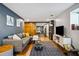 Cozy living room with a comfortable gray sofa, wooden flooring, and a decorative blue patterned rug at 3048 Briarcliff Ne Rd # 9, Atlanta, GA 30329