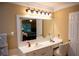 Well-lit bathroom with white vanity, large mirror, and modern fixtures at 3310 Mcclure Woods Ct, Duluth, GA 30096