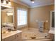 Bathroom features a soaking tub, double sinks, and a large mirror with great lighting at 3310 Mcclure Woods Ct, Duluth, GA 30096