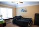 Cozy bedroom with a large window, ceiling fan, and carpeted floor at 3310 Mcclure Woods Ct, Duluth, GA 30096