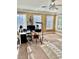 Bonus room features several windows and a white area rug under a modern office and desk setup at 3310 Mcclure Woods Ct, Duluth, GA 30096