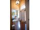 Inviting foyer features a white front door, wood floors, and access to a living area at 3310 Mcclure Woods Ct, Duluth, GA 30096