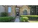 Charming stone-clad home featuring arched windows and a well-maintained front garden at 3310 Mcclure Woods Ct, Duluth, GA 30096