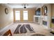 Comfortable living room with a fireplace, neutral paint colors, and ceiling fan at 3310 Mcclure Woods Ct, Duluth, GA 30096