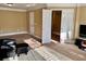 Carpeted Living Room featuring an open doorway and a view of the stairs and the second floor at 3310 Mcclure Woods Ct, Duluth, GA 30096
