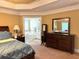 Main bedroom featuring a dresser and a peek into the relaxing en-suite bathroom at 3310 Mcclure Woods Ct, Duluth, GA 30096