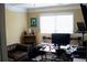Home office setup with multiple monitors, a comfortable leather chair, and shelving at 3310 Mcclure Woods Ct, Duluth, GA 30096
