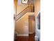 Bright foyer showcases a staircase with decorative molding and dark wood railings at 3310 Mcclure Woods Ct, Duluth, GA 30096