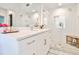 Bathroom featuring white cabinets, a quartz countertop, and a glass shower with subway tile at 68 Peachtree Memorial Nw Dr # 68-5, Atlanta, GA 30309