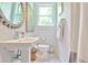 Bathroom featuring white walls, a pedestal sink, and marble floors at 68 Peachtree Memorial Nw Dr # 68-5, Atlanta, GA 30309