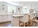 Well-lit kitchen with an island, pendant lights, and a view into the dining area at 68 Peachtree Memorial Nw Dr # 68-5, Atlanta, GA 30309