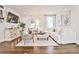 Comfortable living room with white furnishings, hardwood floors, and stylish decor at 68 Peachtree Memorial Nw Dr # 68-5, Atlanta, GA 30309