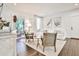 Inviting living room with a plush white couch, natural light, and views of the outdoor porch at 68 Peachtree Memorial Nw Dr # 68-5, Atlanta, GA 30309