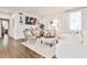 Bright and airy living room with a comfortable white couch, hardwood floors, and large windows at 68 Peachtree Memorial Nw Dr # 68-5, Atlanta, GA 30309