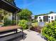 Community outdoor grilling area with stainless steel grills and dining space, set amidst manicured greenery at 68 Peachtree Memorial Nw Dr # 68-5, Atlanta, GA 30309
