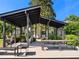 Inviting outdoor lounge area with hammocks, dining tables, and lush landscaping, perfect for relaxing and entertaining at 68 Peachtree Memorial Nw Dr # 68-5, Atlanta, GA 30309