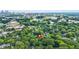 Property aerial view showing lush tree coverage, neighborhood, and nearby lake at 727 Holmes Nw St, Atlanta, GA 30318