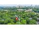 Stunning aerial view of property nestled amongst lush greenery with city skyline in the background at 727 Holmes Nw St, Atlanta, GA 30318