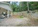 Expansive backyard with a patio, privacy fence, and lush greenery at 727 Holmes Nw St, Atlanta, GA 30318
