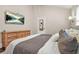Bright bedroom with a large mounted television, wood floors, and vaulted ceilings at 727 Holmes Nw St, Atlanta, GA 30318