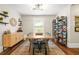 Dining room with wood table, rug, and decorative shelving providing character and charm at 727 Holmes Nw St, Atlanta, GA 30318