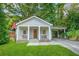 Charming craftsman home with a covered front porch and a convenient carport at 727 Holmes Nw St, Atlanta, GA 30318