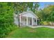 Charming craftsman-style home with covered front porch and lush lawn at 727 Holmes Nw St, Atlanta, GA 30318